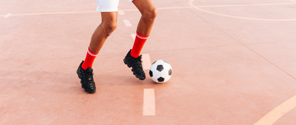 black-man-playing-football-stadium