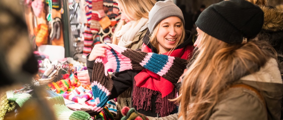 happy-young-women-shopping-at-christmas-market-in-2025-11-13-17-15-58-utc